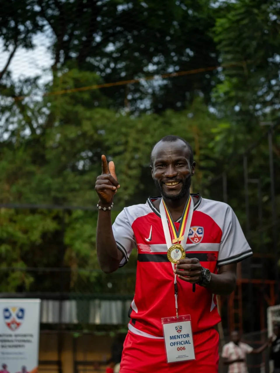 Academy official celebrating tournament success